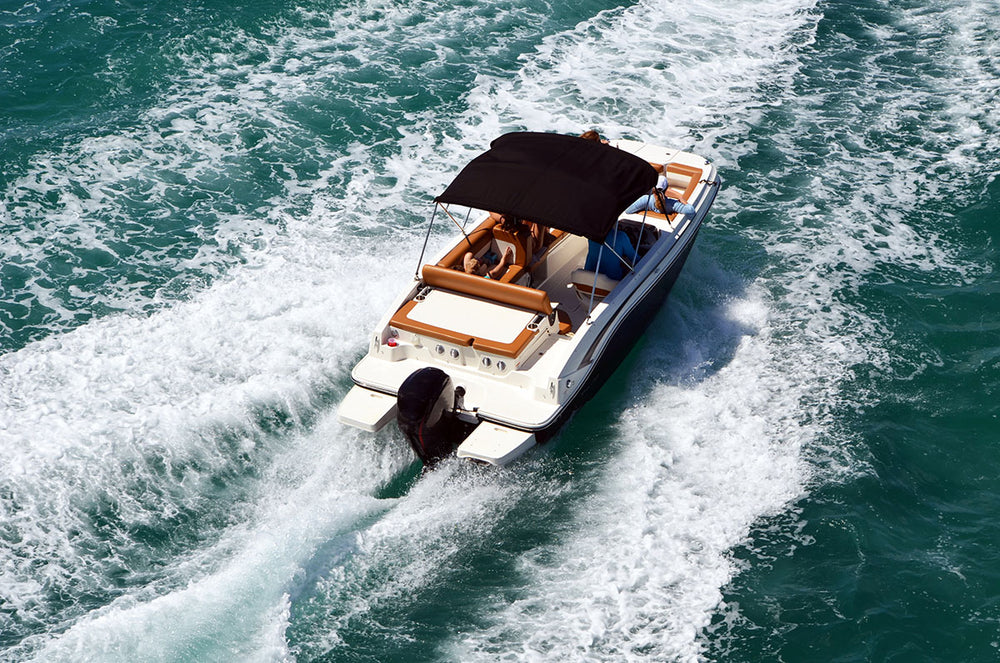 Motorboat with outboard motor on the water